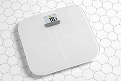 Como posso usar uma balança inteligente Garmin para atingir meus objetivos?